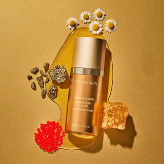Skincare serum bottle with decorative elements on a gold background